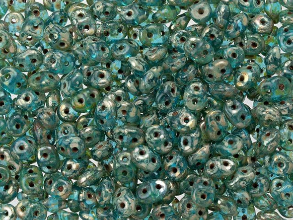 Ocean blue color receives a silvery mottled Picasso finish in these Matubo SuperDuo beads. Create intricate jewelry designs with Czech glass seed beads! Featuring a unique shape and two stringing holes, these seed beads add a special touch of creativity to your designs. They have tapered edges and nest up nicely when strung, making them ideal for floral and woven designs. Add a special touch to your jewelry with Czech glass seed beads!  
