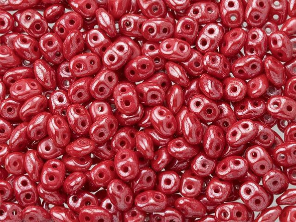 Sweet red color with a lustrous gleam fills these Matubo SuperDuo beads. Create intricate jewelry designs with Czech glass seed beads! Featuring a unique shape and two stringing holes, these seed beads add a special touch of creativity to your designs. They have tapered edges and nest up nicely when strung, making them ideal for floral and woven designs. Add a special touch to your jewelry with Czech glass seed beads!  