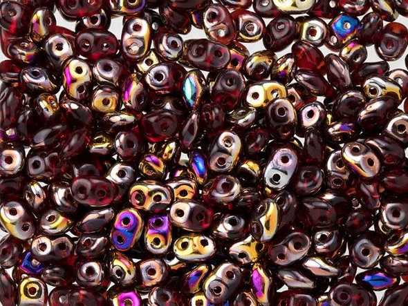 Rich ruby red color combines with iridescent gold and purple tones in these Matubo SuperDuo beads. Create intricate jewelry designs with Czech glass seed beads! Featuring a unique shape and two stringing holes, these seed beads add a special touch of creativity to your designs. They have tapered edges and nest up nicely when strung, making them ideal for floral and woven designs. Add a special touch to your jewelry with Czech glass seed beads!  