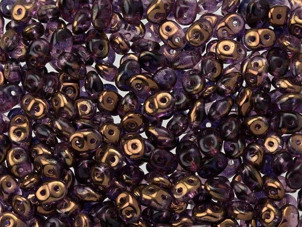 Dark purple color combines with a gleaming bronze shine in these Matubo SuperDuo beads. Create intricate jewelry designs with Czech glass seed beads! Featuring a unique shape and two stringing holes, these seed beads add a special touch of creativity to your designs. They have tapered edges and nest up nicely when strung, making them ideal for floral and woven designs. Add a special touch to your jewelry with Czech glass seed beads!  