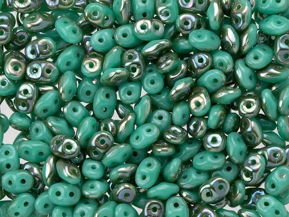 Turquoise green color combines with ethereal metallic tones in these Matubo SuperDuo beads. Create intricate jewelry designs with Czech glass seed beads! Featuring a unique shape and two stringing holes, these seed beads add a special touch of creativity to your designs. They have tapered edges and nest up nicely when strung, making them ideal for floral and woven designs. Add a special touch to your jewelry with Czech glass seed beads!  