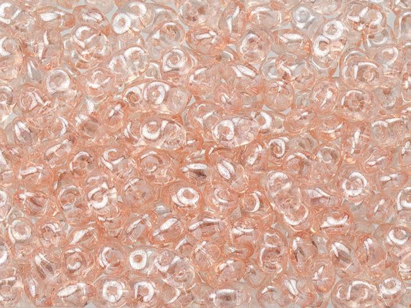 Soft pink color with a lustrous gleam fills these Matubo SuperDuo beads. Create intricate jewelry designs with Czech glass seed beads! Featuring a unique shape and two stringing holes, these seed beads add a special touch of creativity to your designs. They have tapered edges and nest up nicely when strung, making them ideal for floral and woven designs. Add a special touch to your jewelry with Czech glass seed beads!  