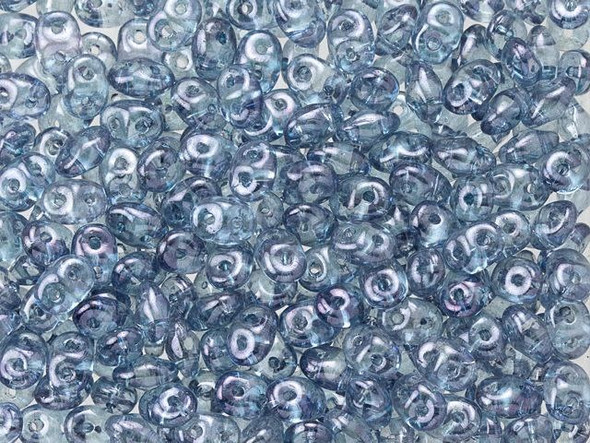 Elegant blue color with a brilliant luster fills these Matubo SuperDuo beads. Create intricate jewelry designs with Czech glass seed beads! Featuring a unique shape and two stringing holes, these seed beads add a special touch of creativity to your designs. They have tapered edges and nest up nicely when strung, making them ideal for floral and woven designs. Add a special touch to your jewelry with Czech glass seed beads!  