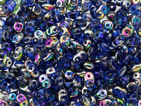 Regal sapphire blue colors combine with iridescent rainbow shine in these Matubo SuperDuo beads. Create intricate jewelry designs with Czech glass seed beads! Featuring a unique shape and two stringing holes, these seed beads add a special touch of creativity to your designs. They have tapered edges and nest up nicely when strung, making them ideal for floral and woven designs. Add a special touch to your jewelry with Czech glass seed beads!  