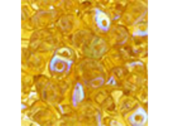 Buttery topaz color gleams with an iridescent finish in these Matubo SuperDuo beads. Create intricate jewelry designs with Czech glass seed beads! Featuring a unique shape and two stringing holes, these seed beads add a special touch of creativity to your designs. They have tapered edges and nest up nicely when strung, making them ideal for floral and woven designs. Add a special touch to your jewelry with Czech glass seed beads!  