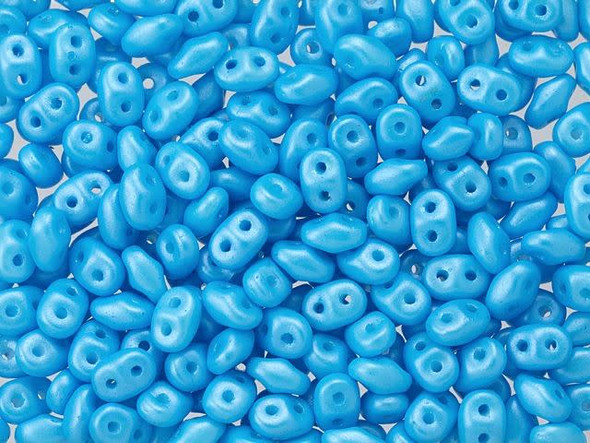 Baby blue color with a pearlescent sheen fills these Matubo SuperDuo beads. Create intricate jewelry designs with Czech glass seed beads! Featuring a unique shape and two stringing holes, these seed beads add a special touch of creativity to your designs. They have tapered edges and nest up nicely when strung, making them ideal for floral and woven designs. Add a special touch to your jewelry with Czech glass seed beads!  