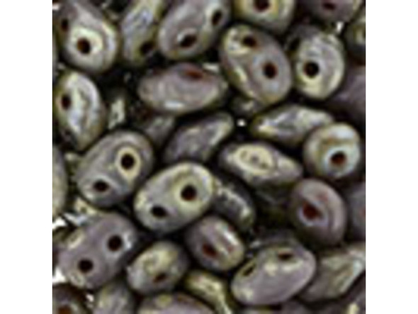 Dusty purple color combines with a mottled and silvery Picasso finish in these Matubo SuperDuo beads. Create intricate jewelry designs with Czech glass seed beads! Featuring a unique shape and two stringing holes, these seed beads add a special touch of creativity to your designs. They have tapered edges and nest up nicely when strung, making them ideal for floral and woven designs. Add a special touch to your jewelry with Czech glass seed beads!  