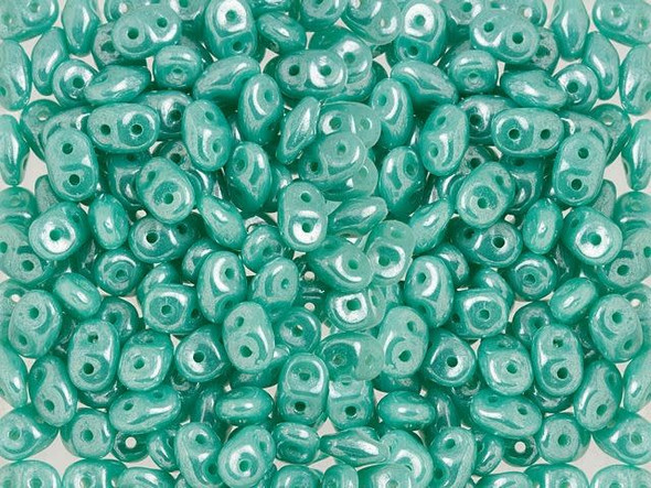 Refreshing style fills these Matubo SuperDuo beads. These seed beads are unique in that they feature an innovative shape and two stringing holes. From a side view, the edges taper at both ends. When strung, the beads nest up nicely. They are excellent for using in woven seed bead designs to add variety of shape. Use them to make floral designs, too. They feature turquoise blue color with a brilliant luster.  