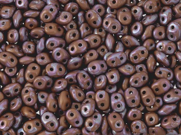 Terracotta color combines with mottled nebula purple in these Matubo SuperDuo beads. Create intricate jewelry designs with Czech glass seed beads! Featuring a unique shape and two stringing holes, these seed beads add a special touch of creativity to your designs. They have tapered edges and nest up nicely when strung, making them ideal for floral and woven designs. Add a special touch to your jewelry with Czech glass seed beads!  