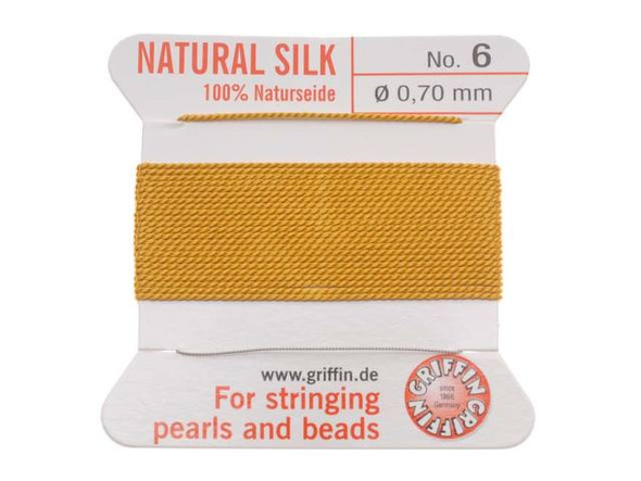 Truly nothing is as soft or as smooth as silk jewelry cord. Silk, also referred to as Naturseide, is the traditional stringing material used by beaders for centuries. Each 100% silk bead cord has a twisted stainless steel needle at the end, which saves you threading time. Doubling the thread is unnecessary, and the cord can be easily knotted because the thread has the correct twist. This card includes approximately 79 inches of cord. The cord features a warm amber color.