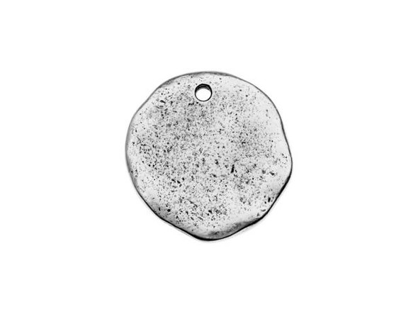 Create something special with this Nunn Design charm. This tag charm features an irregular circle shape with an organic texture. The models for this flat tag were formed by hand, so each one has a beautiful handmade look with an irregular surface. You can showcase this charm as-is or create metal stamped designs, embellish with crystals or epoxy clay, and more. Use the hole at the top of the tag to add this piece to necklaces, bracelets, and even earrings. This charm features a versatile silver shine that will work anywhere.