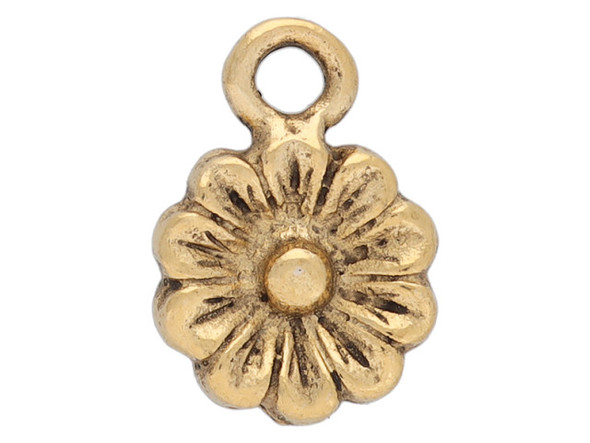 Bring floral style to your designs with this itsy aster flower charm from Nunn Design. This charm is shaped like a flower with petals radiating from its center. The edges of the petals and the center of the flower is raised. This charm has an antique gold color.