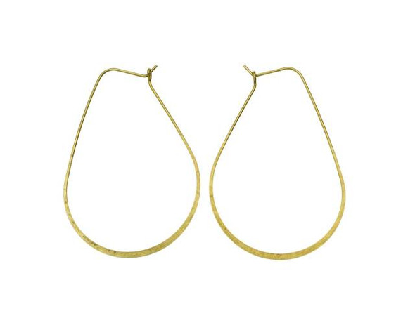 You'll love creating stand-out style with these Nunn Design hoop ear wires. These large hoops take on a beautiful oval drop shape. The bottom of the hoops feature flattened wire for a stylish display. The back of each ear wire hooks into a loop for a secure design that will stay put. You can wear these ear wires as-is. They are bold enough to become stand-alone pieces. You can also wire wrap beads onto the hoop, add dangles to the bottom, and more. These ear wires feature a classic golden glow.