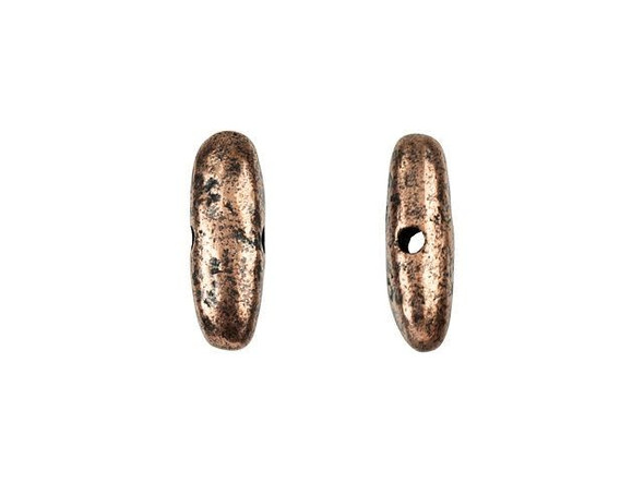 Create a unique style with this Nunn Design bead. This bead features a bold, elongated shape with an organic style. The stringing hole runs through the short middle of the bead, so the elongated ends will stick out in your style. Layer several of these beads together for a chunky, stacked look, or pair it with more classic rounds for contrast. It will create an eye-catching look no matter what.