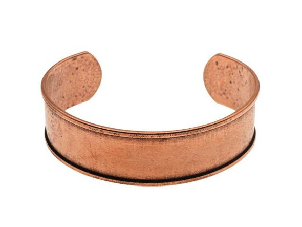 Add unique style to your looks with the help of the Nunn Design antique copper-plated Brass cuff bracelet. This cuff features a smooth surface and raised edges, giving you a recessed area to embellish. You can add epoxy clay or other mixed media elements to completely transform this piece. You could even decorate this bracelet with trendy leather. This cuff features a generous opening in the back, so it's easy to take on and off. It displays a dark copper color, perfect for using with rich earth tones or royal colors. Length 6 Inch, Thickness 1.6mm/14 gauge, Width 19mm