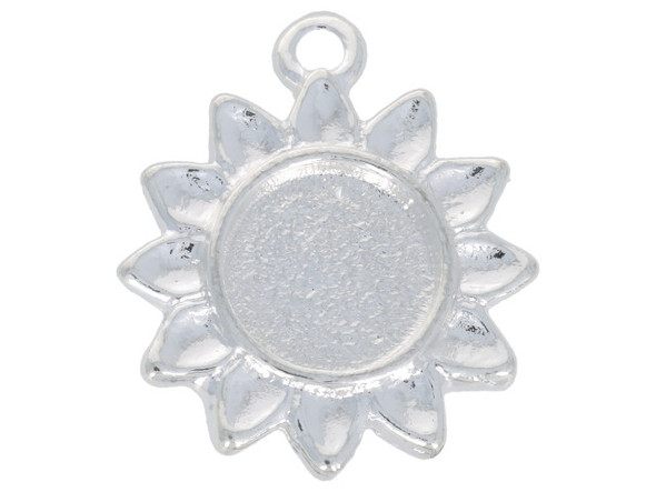 Floral style fills this itsy bezel sunflower pendant from Nunn Design. This pendant is shaped like a sunflower. The center of the flower is a round bezel with a flat bottom.  It would work well with resin or epoxy clay. There is a loop at the top of the pendant, so it is easy to add it to your designs. This pendant features a versatile silver shine. Bezel Dimensions: Inner Diameter 9.3mm, Depth 1mm