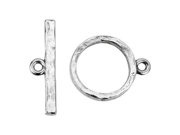 Finish designs with flair using the Nunn Design antique silver-plated pewter contemporary toggle clasp set. This simple toggle clasp set includes a straight bar component and a circular loop component. Each one has a loop attached to it so you can easily add them to designs. The hammered texture creates an earthy look perfect for modern and boho styles alike. This clasp will make your jewelry easy to take on and off, so use it in necklaces and bracelets. It features a soft silver shine. Bar Length 28mm, Hole Size 2mm/12 gauge, Loop Length 23mm, Loop Width 19mm, Opening Diameter 15mm