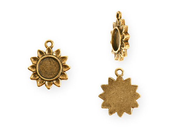 Floral style fills this itsy bezel sunflower pendant from Nunn Design. This pendant is shaped like a sunflower. The center of the flower is a round bezel with a flat bottom.  It would work well with resin or epoxy clay. There is a loop at the top of the pendant, so it is easy to add it to your designs. This pendant features a classic gold color. Bezel Dimensions: Inner Diameter 9.3mm, Depth 1mm