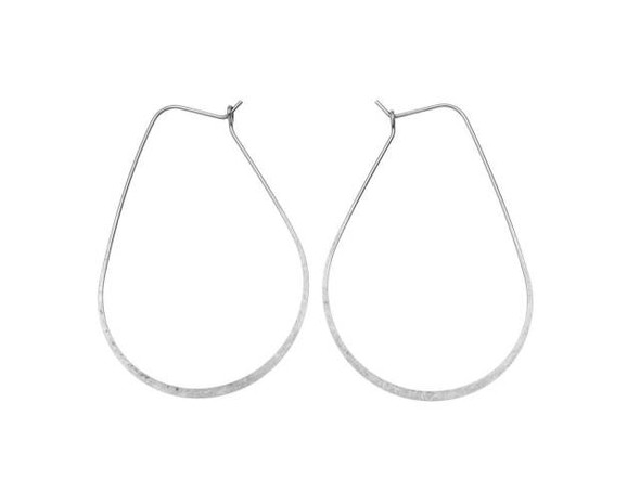 For unforgettable style, try these Nunn Design hoop ear wires. These large hoops take on a beautiful oval drop shape. The bottom of the hoops feature flattened wire for a stylish display. The back of each ear wire hooks into a loop for a secure design that will stay put. You can wear these ear wires as-is. They are bold enough to become stand-alone pieces. You can also wire wrap beads onto the hoop, add dangles to the bottom, and more. These ear wires feature a versatile silver color that will work anywhere.