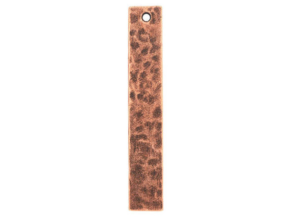 Add texture to designs with the Nunn Design copper-plated pewter flat hammered long narrow tag pendant. This thin, long rectangular pendant features a flat surface. Both sides of the pendant feature a hammered texture for a unique display. You can stamp the surface of this pendant for a customized look. A stringing hole is drilled through the top, so you can easily add it to designs. Use it as a focal in a necklace or add it to eye-catching earring designs. It features a warm copper glow. Hole Size 1.3mm/16 gauge, Length 45mm, Width 7.5mm