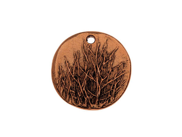 Gather inspiration from nature with this Nunn Design charm. This charm is circular in shape and features a raised design of aspen trees that have lost their summertime leaves and display bare branches. The back of this charm is plain. A small hole at the top of the charm makes it easy to add to designs. Add it to a charm bracelet or use it as the focal of a delicate necklace. It features a warm copper glow, perfect for pairing with earthy colors. Diameter 20mm, Hole Size 1.63mm/14 gauge