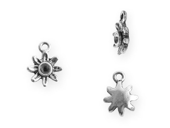 Add a flowery touch to your designs with this tiny bezel daisy charm from Nunn Design. This charm features a daisy shape with a round bezel in the center. This bezel has a 3mm diameter and works well with 24pp size chatons. There is a loop at the top of the charm which makes it easy to add to your designs. This charm features an antique silver color. Bezel Dimensions: Inner Diameter 3mm