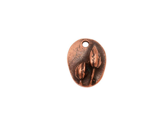 You&rsquo;ll love the detail of this small prairie pod charm from Nunn Design. This charm is oval-shaped and features a raised design of two flowers on the front.  The back is flat and plain. There is a hole at the top of the charm so it is easy to add it to your designs. This charm features a warm antique copper color. Dimensions: 13.5 x 10.5mm, Hole Size: 2.0mm