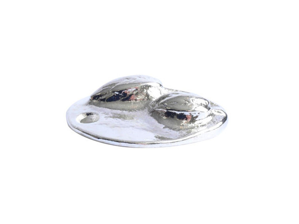 You&rsquo;ll love the detail of this small prairie pod charm from Nunn Design. This charm is oval-shaped and features a raised design of two flowers on the front.  The back is flat and plain. There is a hole at the top of the charm so it is easy to add it to your designs. This charm features a bright silver shine that will work with any color palette. Dimensions: 13.5 x 10.5mm, Hole Size: 2.0mm