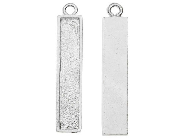 Have fun using the Nunn Design silver-plated pewter Itsy rectangle pendant in your designs. This pendant features a narrow rectangular shape with a recessed bezel center that can be filled with Flatbacks, epoxy clay and other mixed media elements. It's a great way to customize your style. It features a smooth, flat back. A loop is attached to the top, so you can easily add it to designs. It features a brilliant silver glow. Hole Size 1.6mm/14 gauge, Length 32mm, Width 6.5mm