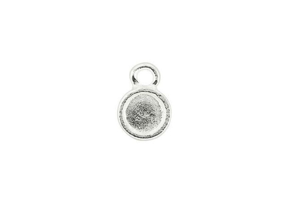 For a small showcase, try this Nunn Design bezel charm. This small charm takes on a circular shape, with a bezel that's the perfect size for holding a PRESTIGE Flatback in size SS20. You can also fill this bezel with epoxy clay or resin for a completely custom style. The loop at the top of the charm makes it easy to add to any design. Layer it with other charms or showcase this piece all on its own. It features a silver shine full of versatility. Bezel Inside Diameter 5mm, Bezel Depth 1mm