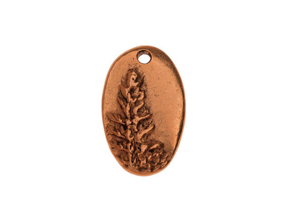 You'll love the woodland look of this Nunn Design charm. This charm features an oval shape with organic style. The front is decorated with a raised design of a pine tree, which captures the details of the forest beautifully. The back of this charm is plain. A small hole at the top of the charm makes it easy to add to designs. Use it in bracelets, earrings, or even as a focal in a delicate necklace. It features a warm copper glow, perfect for pairing with earthy tones. Hole Size 1.63mm/14 gauge, Length 21mm, Width 13mm