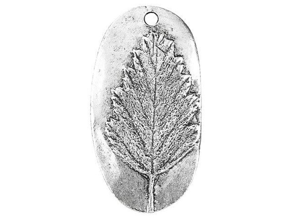 Add nature's beauty to your jewelry designs with this Nunn Design charm. This charm takes on an oval shape and the front features a raised design of an Alder leaf. The leaf is full of beautiful details that will draw the eye to your jewelry designs. Use the hole at the top of the charm to easily dangle it from necklaces and even earrings. It will make a wonderful showcase in any project. The back of the charm is flat and features an impression of the design on the front.