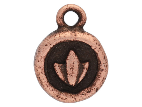 Add a meaningful detail to your designs with this itsy circle lotus charm from Nunn Design. This small charm is circular in shape and the front features a raised design of a lotus blossom. The back is plain. The lotus is a symbol of purity and enlightenment, meant to represent life and new beginnings. This charm features a copper color with dark tones in the recesses of the design.
