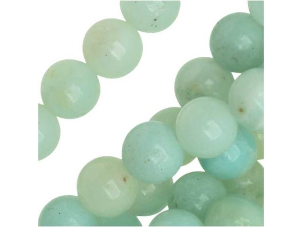 Create tropical style with help from the Dakota Stones Amazonite 6mm round beads. These beads feature a classic round shape you can add to any design. They are versatile in size, so add them to necklaces, bracelets and earrings. Each bead features opaque ocean colors that range from blue-green to green. Amazonite is also known as Amazon stone. Metaphysical Properties: Amazonite is said to balance energy, while promoting harmony and universal love. It is often called the stone of courage and the stone of truth, as it provides the ability to discover truths and integrity.Because gemstones are natural materials, appearances may vary from piece to piece. Each strand includes approximately 34 beads.