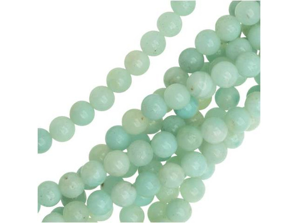 Create tropical style with help from the Dakota Stones Amazonite 6mm round beads. These beads feature a classic round shape you can add to any design. They are versatile in size, so add them to necklaces, bracelets and earrings. Each bead features opaque ocean colors that range from blue-green to green. Amazonite is also known as Amazon stone. Metaphysical Properties: Amazonite is said to balance energy, while promoting harmony and universal love. It is often called the stone of courage and the stone of truth, as it provides the ability to discover truths and integrity.Because gemstones are natural materials, appearances may vary from piece to piece. Each strand includes approximately 34 beads.