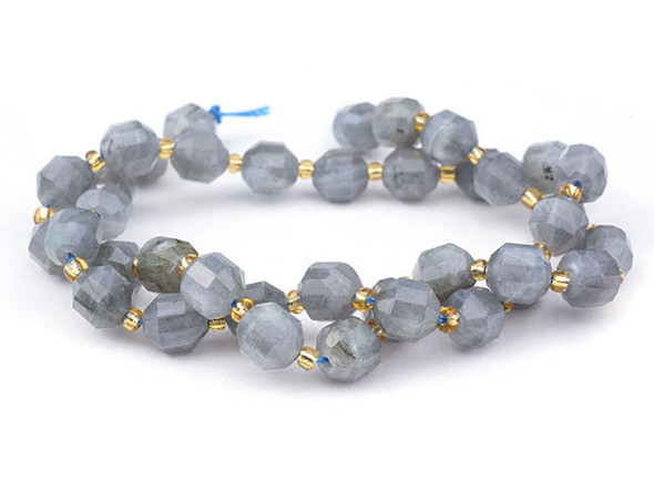Energize your designs with this Dakota Stones labradorite faceted 8mm energy prism bead strand. The beads on this strand feature a faceted cut helping them catch the light. This strand features spacers between each of the beads, so you could use it as-is, or string the beads into a design. Labradorite is named for Labrador Island in Canada, where it was first discovered. Metaphysical Properties: Labradorite is said to detoxify the body and slow the aging process. Because gemstones are natural materials, appearances may vary from piece to piece.