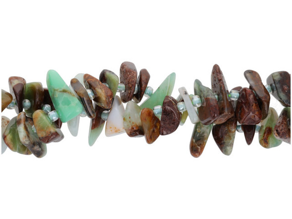 Bring earthy style to your designs with this Dakota Stones Australian chrysoprase 10 x 4mm knotted chip bead strand. These beads feature organic shapes that let each bead be unique. These beads feature a mix of green, brown and yellow colors. Chrysoprase is a gemstone variety of chalcedony and contains small quantities of nickel. These beads feature varying shades of green, from mint to moss, along with hints of brown and gray. Metaphysical Properties: Chrysoprase is said to be a stone that encourages hope and joy. Because gemstones are natural materials, appearances may vary from piece to piece. Size: About 10 x 4mm, Hole Size: 0.8mm