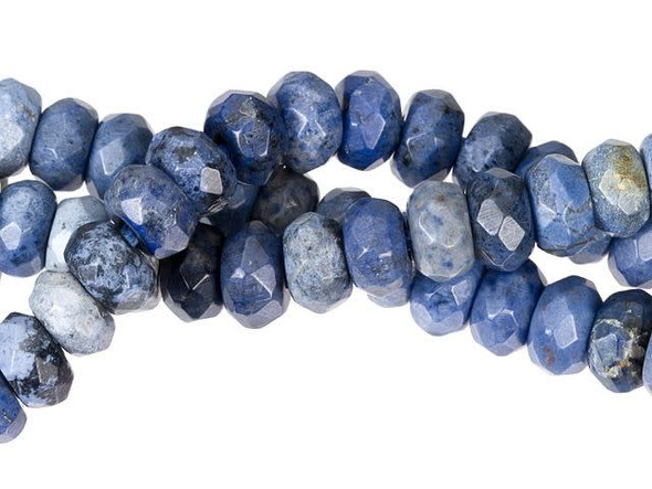 Colorful elegance fills the Dakota Stones 8mm sunset dumortierite large-hole faceted roundel beads. Each bead features a rounded shape with a faceted surface. They are the perfect size for matching necklace and bracelet sets. Each bead features a wide stringing hole, perfect for using with thicker stringing materials like leather cord. These beads feature dark blue, blue-green and cloudy white colors, with hints of reddish brown thrown in. Metaphysical Properties: Dumortierite is said to enhance organizational abilities and orderliness.Because gemstones are natural materials, appearances may vary from piece to piece. Each strand includes approximately 24 beads.