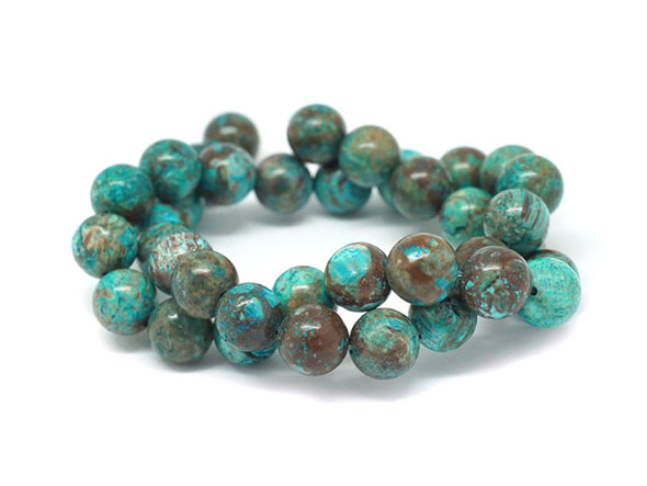 Bring gemstone style to your designs with this Dakota Stones blue sky jasper 10mm round bead strand. These beads feature a classic round shape and a vibrant blue color mixed with greens and browns. Their 10mm size will make them stand out in your projects. Because gemstones are natural materials, appearances may vary from piece to piece.