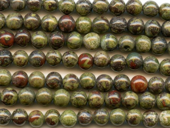 Give your designs natural woodland color with the dragon blood jasper 6mm round beads from Dakota Stones. These round beads feature deep forest green color with splatters of crimson red. The two primary colors contrast and complement each other to form a striking jasper. This gemstone is mined in Australia. Dragon blood jasper is part of the quartz family. Metaphysical Properties: Dragon blood jasper enhances courage, strength and vitality.Because gemstones are natural materials, appearances may vary from bead to bead. Each strand includes approximately 34 beads.