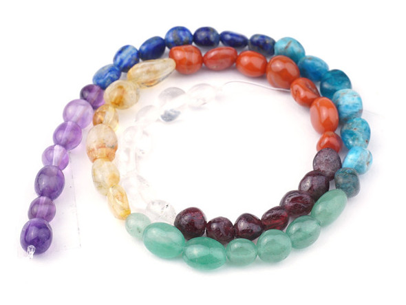 This Dakota Stones Chakra Bead Strand contains 8 different varieties of gemstones representing the different Chakras. The included gemstones are Amethyst, Lapis, Blue Apatite, Green Aventurine, Citrine, Carnelian, Red Garnet and Crystal Quartz. These beads feature organic pebble shapes. Because gemstones are natural materials, appearances may vary from piece to piece.