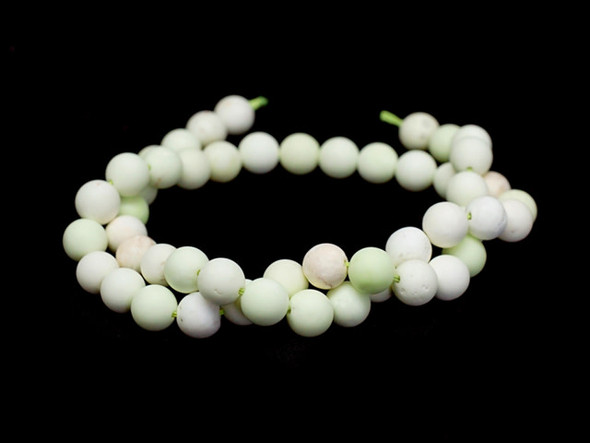 Be inspired by these 8mm round gemstone beads from Dakota Stones. These beads feature a classic round shape and a matte finish. Chrysoprase is a bright apple green, translucent stone, whose color often caused ancient jewelers to confuse it with Emerald. A cryptocrystalline Chalcedony, its brilliant color comes from the presence of very small inclusions of Nickel compounds. Chrysoprase is believed to balance the heart chakra and help one understand their needs and emotions. Because gemstones are natural materials, appearances may vary from bead to bead.