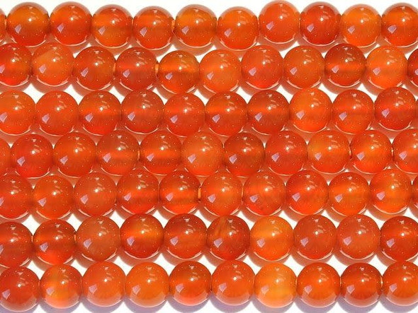 Create a display of shining sunset colors in your designs with the carnelian 8mm large-hole round beads from Dakota Stones. Available by the strand, these gemstone beads will amaze and delight with their innovative design. Each bead features a wide stringing hole, perfect for using with thicker stringing materials like leather cord. In fact, these beads are temporarily strung on leather cord. These perfectly round beads feature deep red-orange color. Carnelian is a translucent chalcedony that receives its beautiful red tints from iron oxides. Most deep red carnelian is heat treated to darken the material. Metaphysical Properties: Sometimes referred to as the "Stone of Transformation," carnelian is used to encourage the expression of love and the purity of the heart.Because gemstones are natural materials, appearances may vary from piece to piece. Carnelian is heat-treated to have a consistent color across the bead and strand. The color is very consistent. Each strand includes approximately 24 beads.
