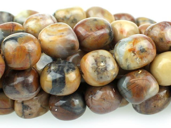 Bring organic style to designs with the Dakota Stones 8x10mm Venus Jasper tumble nugget beads. These beads feature a rounded nugget-like shape. They are bold in size, so they are sure to stand out in necklaces, bracelets and earrings. Use them to add contemporary flair to your designs. These gemstone beads feature warm, earthy tones like beige, peach, brown and gray. They are sure to add soothing style to your designs. Venus Jasper takes its name from the planet Venus, which was named for the Roman goddess of love and beauty. It is also referred to as orbicular rhyolite. Metaphysical Properties: Jasper is a stone used from grounding, stability, strength and healing. Because gemstones are natural materials, appearances may vary from piece to piece. Each strand includes approximately 21 beads.Length 8.5-11mm, Width 6-8.5mm