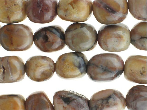 Bring organic style to designs with the Dakota Stones 8x10mm Venus Jasper tumble nugget beads. These beads feature a rounded nugget-like shape. They are bold in size, so they are sure to stand out in necklaces, bracelets and earrings. Use them to add contemporary flair to your designs. These gemstone beads feature warm, earthy tones like beige, peach, brown and gray. They are sure to add soothing style to your designs. Venus Jasper takes its name from the planet Venus, which was named for the Roman goddess of love and beauty. It is also referred to as orbicular rhyolite. Metaphysical Properties: Jasper is a stone used from grounding, stability, strength and healing. Because gemstones are natural materials, appearances may vary from piece to piece. Each strand includes approximately 21 beads.Length 8.5-11mm, Width 6-8.5mm
