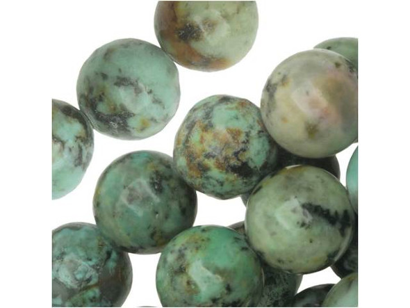 Bring fascinating style to designs with these Dakota Stones beads. These gemstone beads are perfectly round in shape and would look great in matching necklace and bracelet sets. The beads feature turquoise color with a brown and black matrix. This stone is mined in Africa and is actually a type of spotted teal Jasper rather than turquoise. It is given its industry name because the matrix structure and shade is similar to that of turquoise. It has a Mohs hardness of 6. Metaphysical Properties: Often called the stone of evolution, African Turquoise Jasper encourages growth and development not only in the body, but in the mind. Some spiritualists believe that it will attract money to the wearer.Because gemstones are natural materials, appearances may vary from piece to piece. Each strand includes approximately 24 beads.