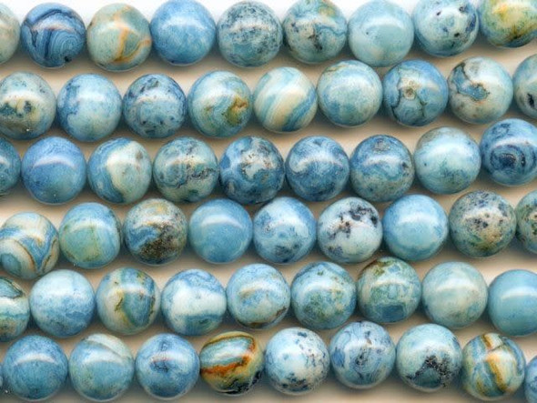 You can swirl vibrant blue color into your designs with the blue crazy lace agate 8mm round beads from Dakota Stones. These round beads feature bright blue color swirled with white and the occasional hint of green. They have a Mohs hardness of 6.5-7. Mexican crazy lace agate is normally an opaque white gemstone with swirling patterns, but these beads are color enhanced to emphasize these beautiful patterns. Color enhancing is common amongst agates to make them fashionably relevant. Metaphysical Properties: Often called the happy stone, crazy lace agate promotes laughter and optimism. Because gemstones are natural materials, appearances may vary from bead to bead. Each strand includes approximately 24 beads.