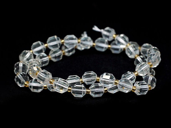 Energize your designs with this Dakota Stones crystal quartz faceted 8mm energy prism bead strand. The beads on this strand feature a faceted cut helping them catch the light. This strand features spacers between each of the beads, so you could use it as-is, or string the beads into a design. Crystal Quartz naturally occurs as clear and colorless. It is a crystalline form of Quartz said to include the ability to absorb and radiate the energy that is put into it to help people achieve their goals. Due to the color and the clarity of the Quartz, it was thought to be permanently frozen water until the 17th century. Because gemstones are natural materials, appearances may vary from bead to bead.