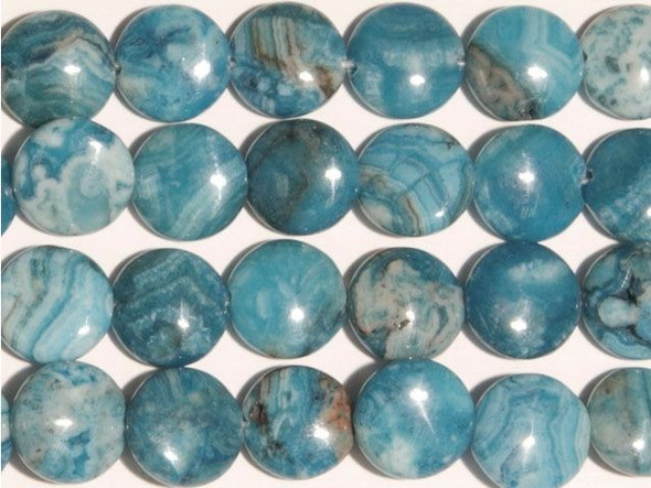 Beautiful blue hues fill the blue crazy lace agate 12mm coin beads from Dakota Stones. Available by the strand these circular coin-shaped beads feature bright blue color swirled with white and the occasional hint of green. These beads are perfect for showcasing in necklace designs along with other tropical beads. Mexican crazy lace agate is normally an opaque white gemstone with swirling patterns, but these beads are color enhanced with blue coloring to emphasize these beautiful patterns. Color enhancing is common amongst agates to make them fashionably relevant. They have a Mohs hardness of 6.5-7. Metaphysical Properties: Often called the happy stone, crazy lace agate promotes laughter and optimism. Because gemstones are natural materials, appearances may vary from piece to piece. Each strand includes approximately 16 beads. 