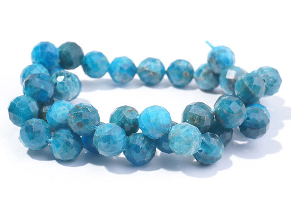Gemstone style fills these beads from Dakota Stones. These blue apatite beads have a round shape with facets that catch the light. Blue apatite is a blue transparent phosphate material. It derives from the Greek word "apate," meaning to deceive, because it is often mistaken for other stones. The color of this material is such a vibrant blue that it is difficult to believe it could be found naturally. But this color is 100% natural. Mined in Brazil, Mexico, Myanmar, Africa and the USA, this stone has a Mohs hardness of 5. Metaphysical Properties: Often called a dual-action stone, blue apatite is used to achieve goals. It removes negativity, confusion and stimulates the mind to expand knowledge and truth. It is a great stone for encouraging inspiration and is famous for deepening meditation.Because gemstones are natural materials, appearances may vary from piece to piece.
